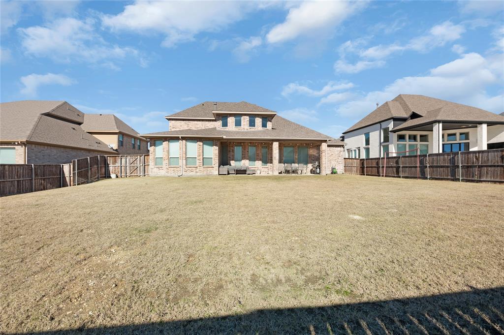 1510 Chisholm Trail Prosper, TX 75078 - Photo 31 of 32 a front view of a house with a yard