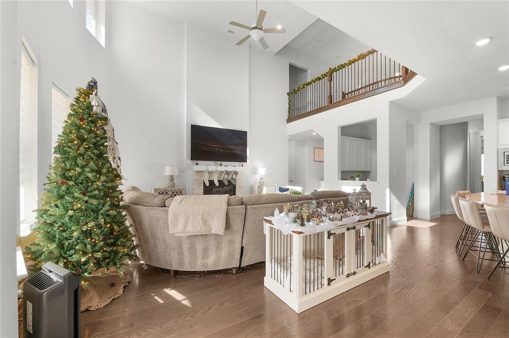 1510 Chisholm Trail Prosper, TX 75078 - Photo 4 of 32 a living room with furniture and a flat screen tv