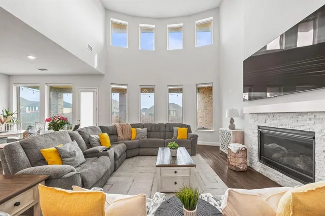 a living room with furniture fireplace and a flat screen tv