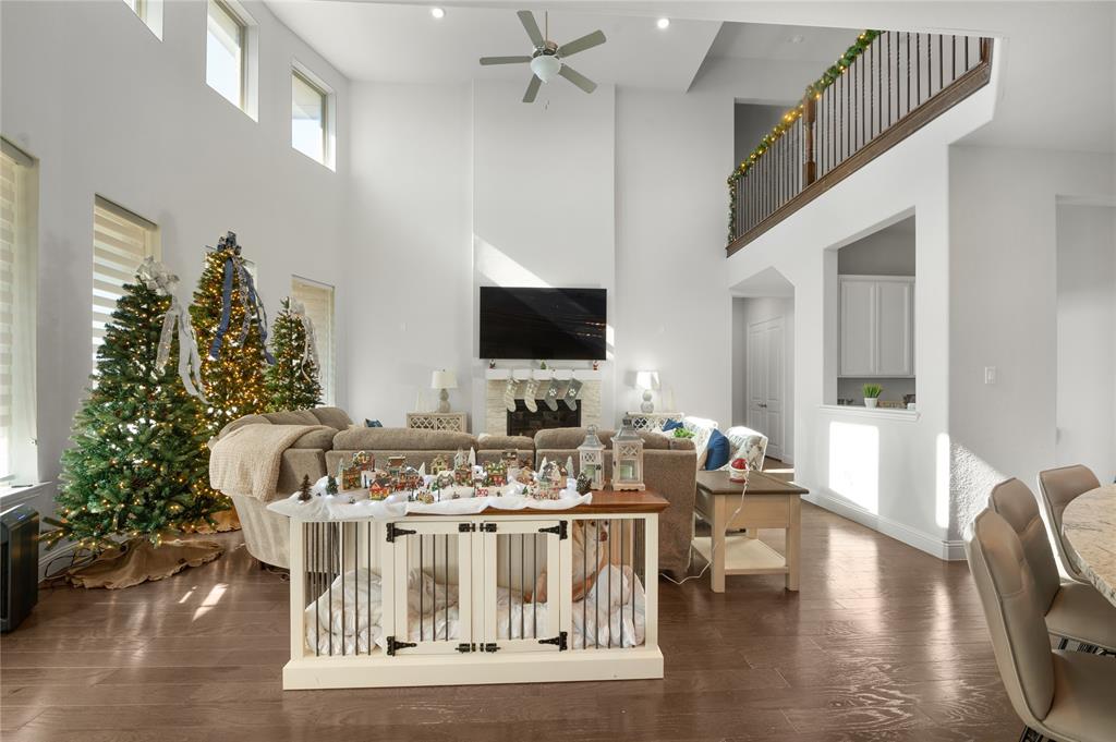 1510 Chisholm Trail Prosper, TX 75078 - Photo 5 of 32 a living room with furniture and a flat screen tv