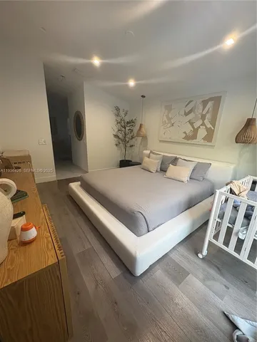 a large bathroom with a large tub and sink