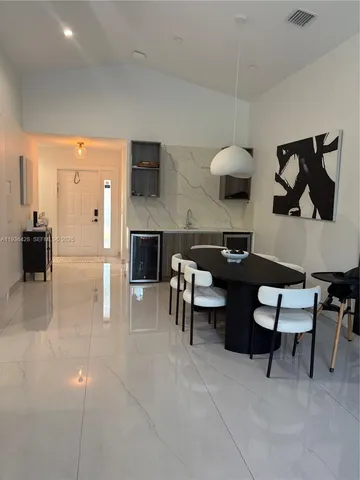 a view of a chairs and table in backyard