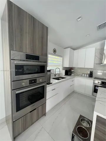a bathroom with a shower and a sink