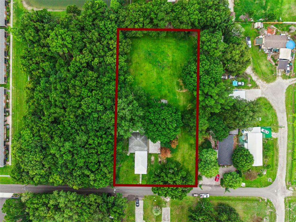 420 Jacks Memorial Road St. Cloud, FL 34769 - Photo 5 of 31 a view of a garden with plants and large trees