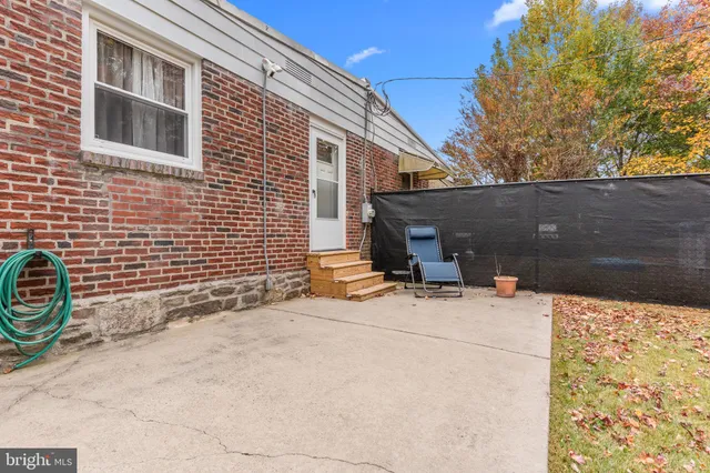 a backyard of a house with yard and garage