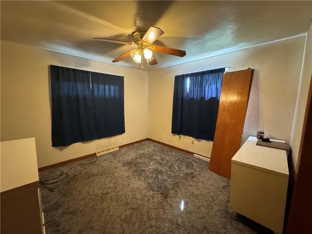 a view of an empty room with a bathroom