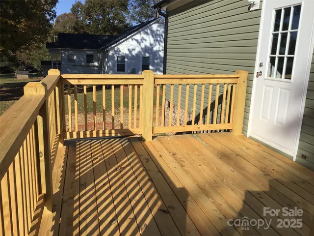 a view of wooden balcony with outdoor space