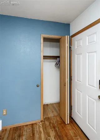 an empty room with wooden floor