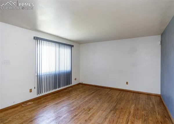 a kitchen with refrigerator cabinets and microwave