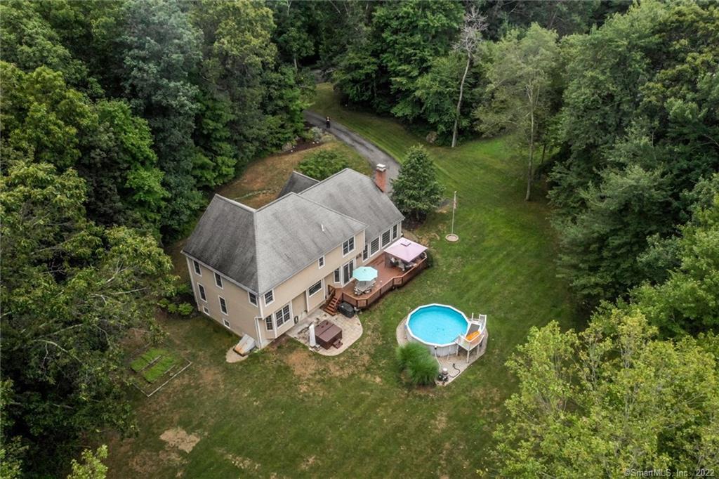 35 Obtuse Rocks Road Brookfield, CT 06804 - Photo 1 of 1 a view of a backyard with chairs and a grill