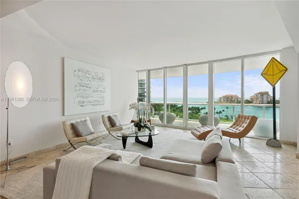 a living room with a table and chairs