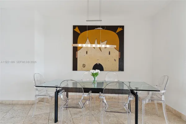 a living room with a large window and a table