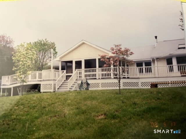 118 River Road Madison, CT 06443 - Photo 31 of 38 The deck runs the whole length of the house.