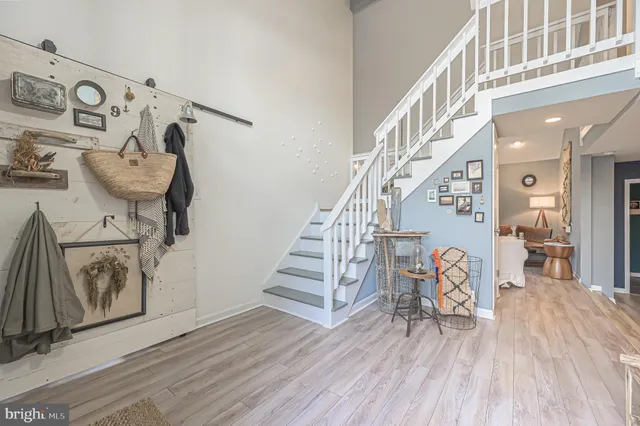 a living room with furniture and a clock