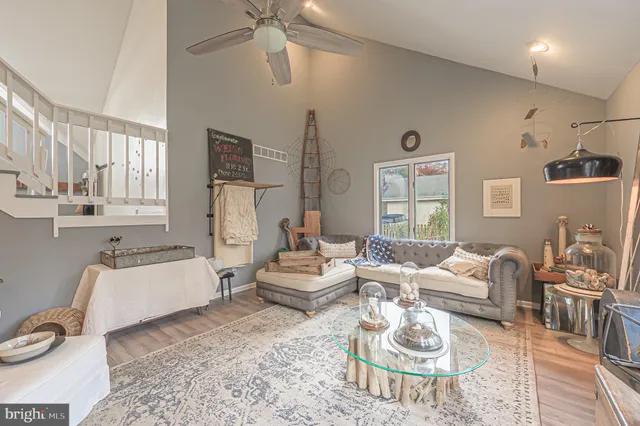 a living room with furniture and a table