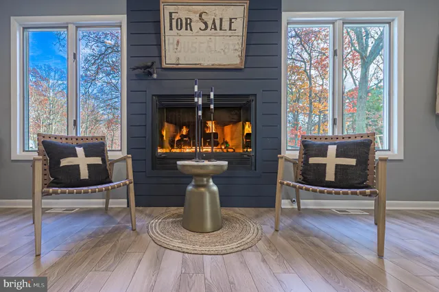 a kitchen with kitchen island granite countertop wooden floors and stainless steel appliances