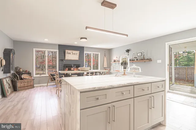 a workspace with white cabinets