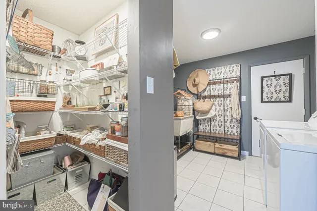 a view of living room with furniture and a fireplace