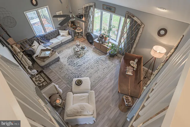 a bathroom with a granite countertop sink mirror vanity and toilet