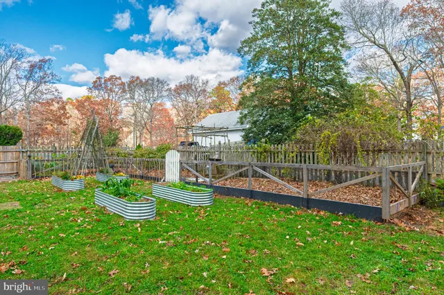 a view of a backyard with sitting area and slide