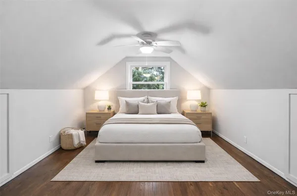 a bedroom with bed and a window