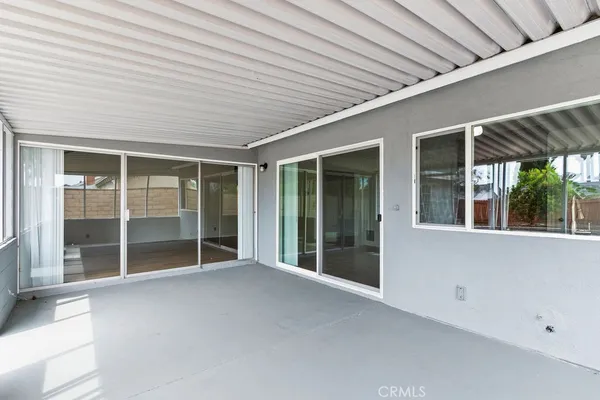 a view of an empty room with a large window