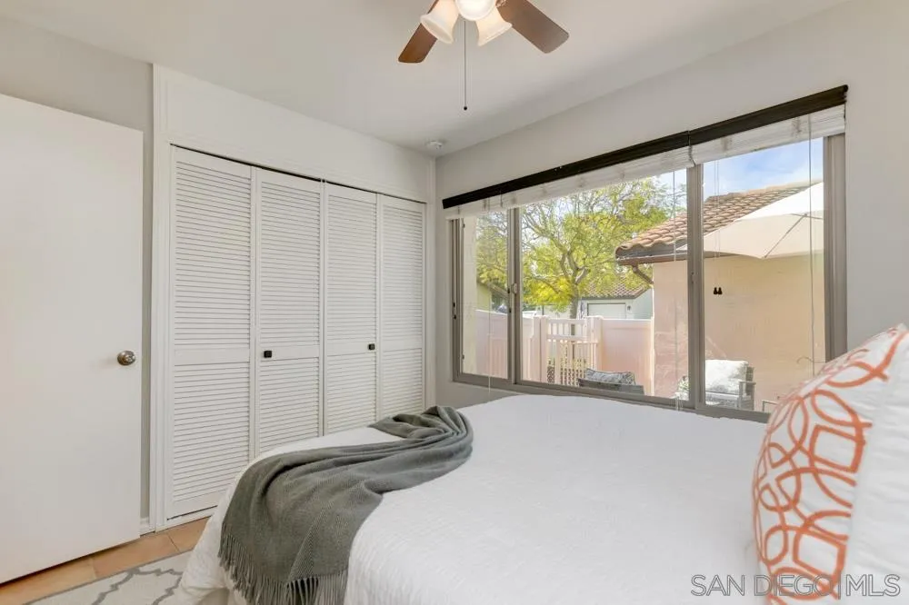 1750 Charleston Lane Encinitas, CA 92024 - Photo 14 of 25 a bedroom with a large bed and a large window