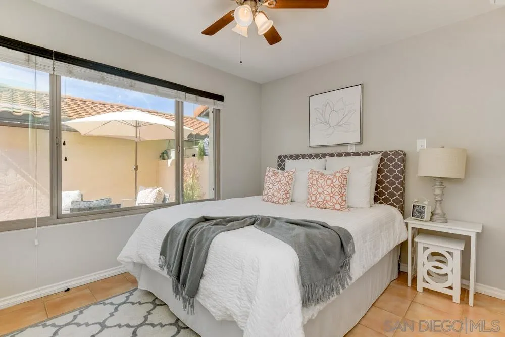 1750 Charleston Lane Encinitas, CA 92024 - Photo 15 of 25 a bedroom with a large bed and a large window