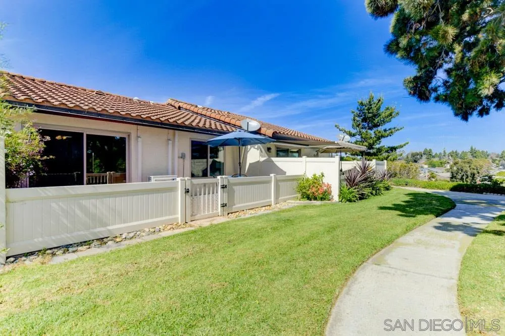 1750 Charleston Lane Encinitas, CA 92024 - Photo 22 of 25 a view of a house with backyard and a tree
