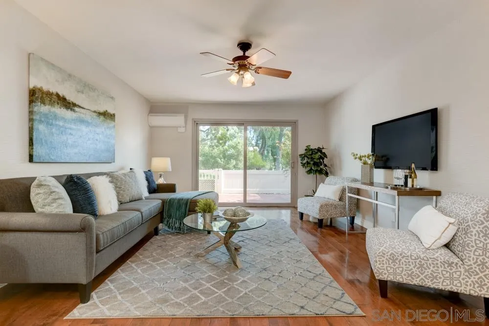 1750 Charleston Lane Encinitas, CA 92024 - Photo 4 of 25 a living room with furniture and a flat screen tv