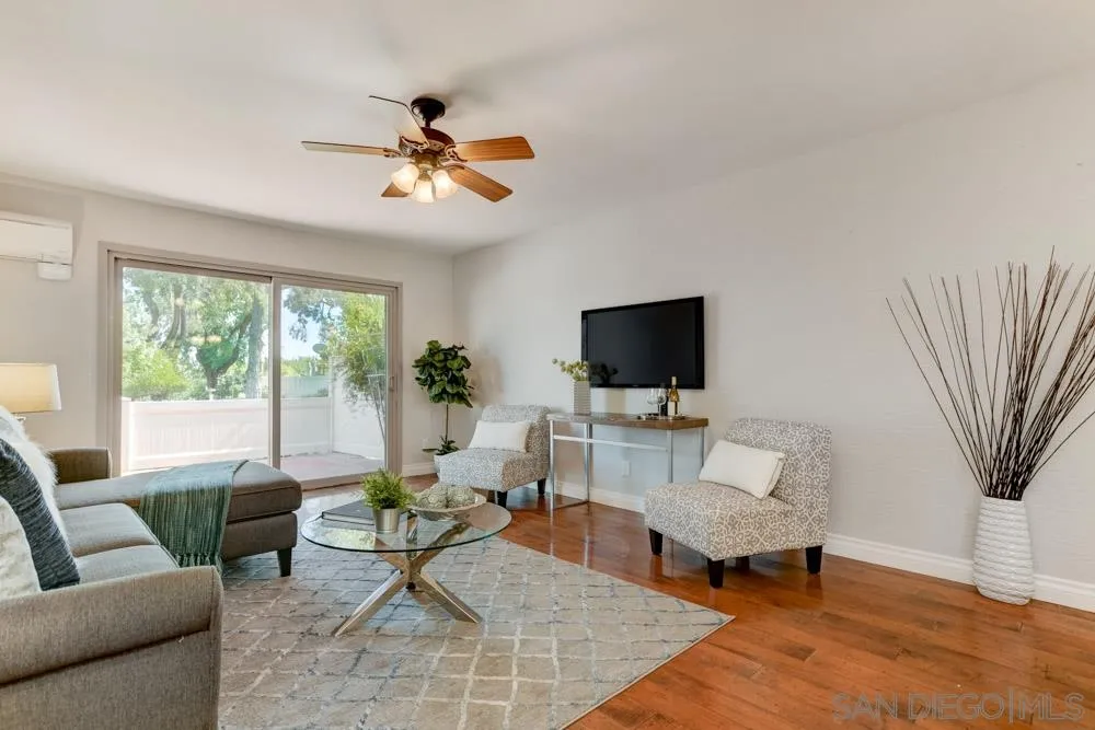 1750 Charleston Lane Encinitas, CA 92024 - Photo 5 of 25 a living room with furniture a flat screen tv and a large window