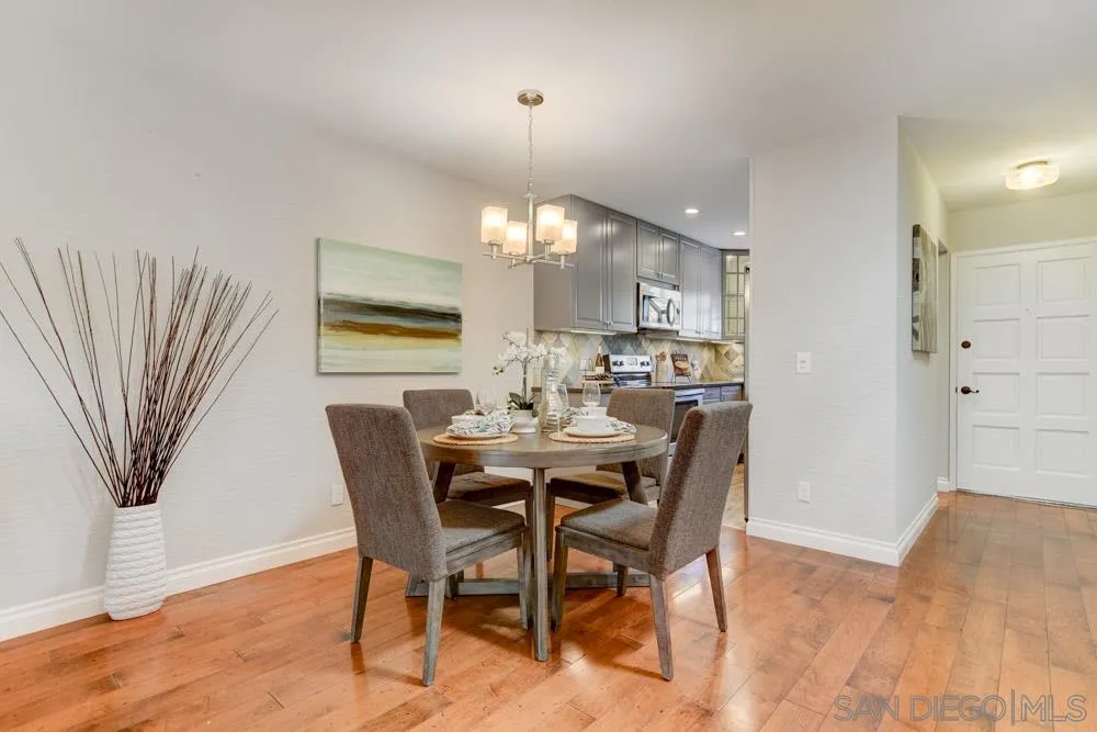 1750 Charleston Lane Encinitas, CA 92024 - Photo 8 of 25 a view of a dining room with furniture and wooden floor