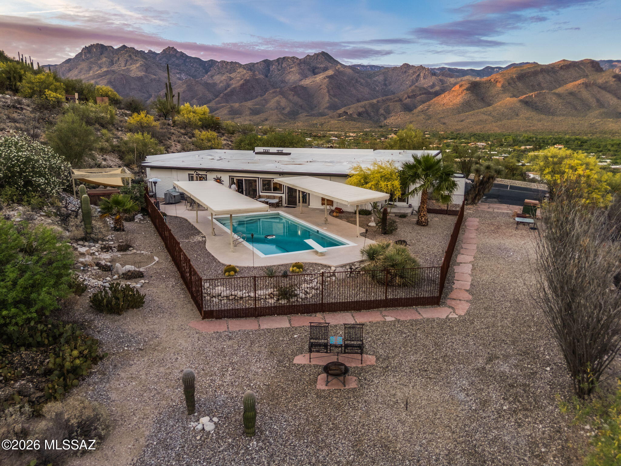 4641 North Rockcliff Road Tucson, AZ 85750 - Photo 1 of 48 Aerial shot, fenced pool on a 1.1 acre lot with Catalina Mountains in distance