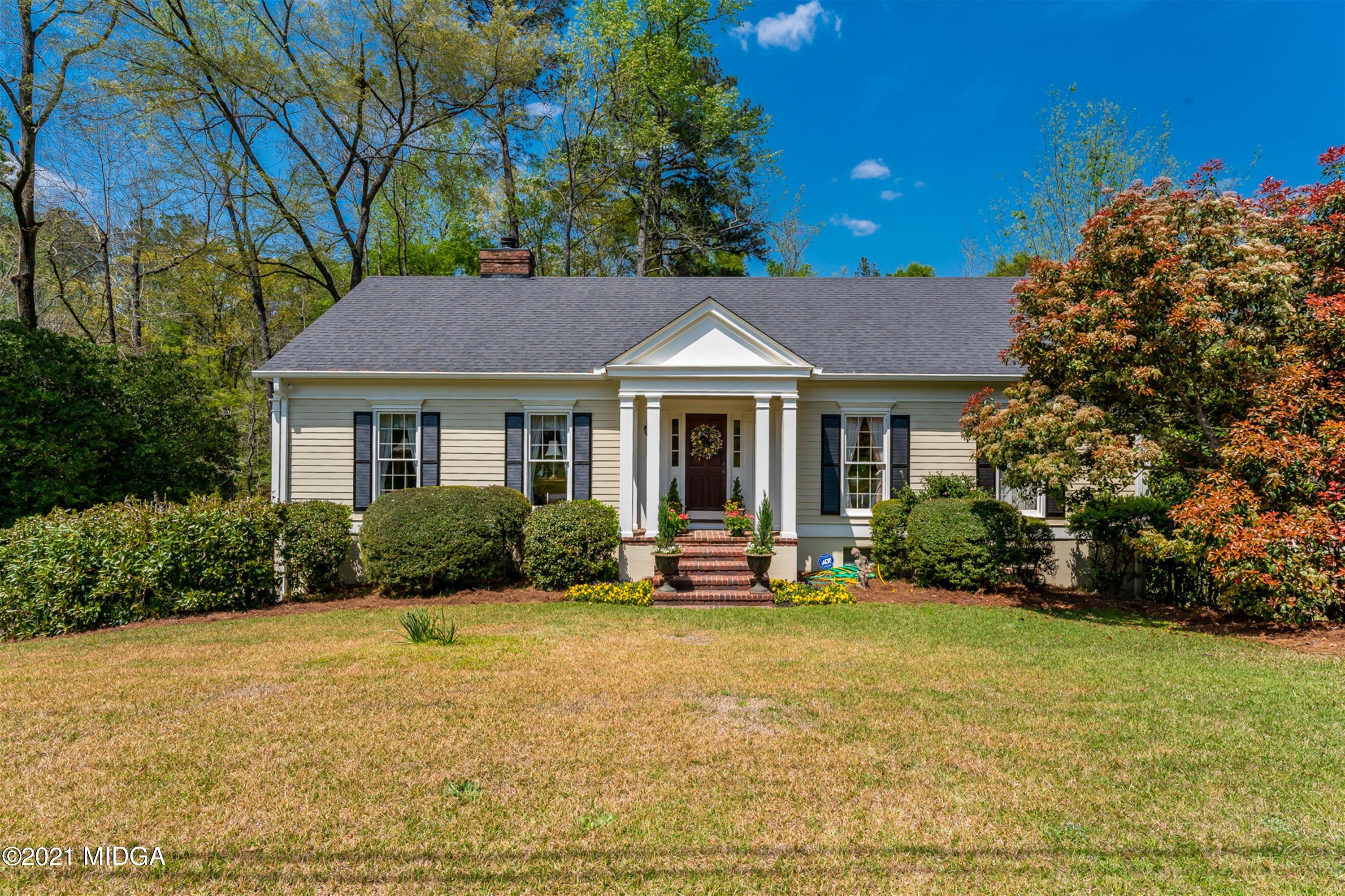 1946 Wood Valley Road Macon, GA 31211 - Photo 1 of 35 a front view of a house with a yard and outdoor seating