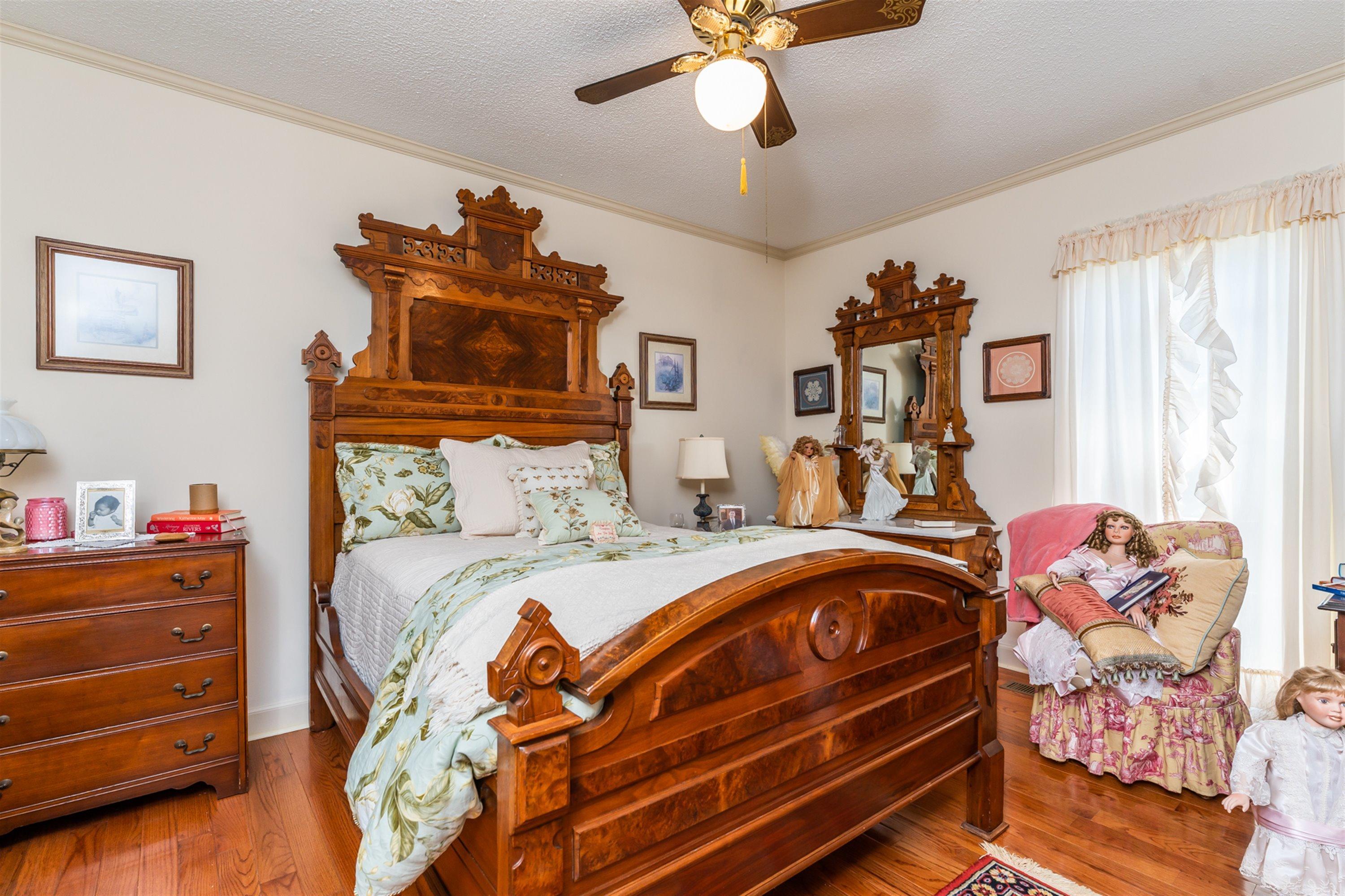 1946 Wood Valley Road Macon, GA 31211 - Photo 21 of 35 a bedroom with a bed and wooden floor