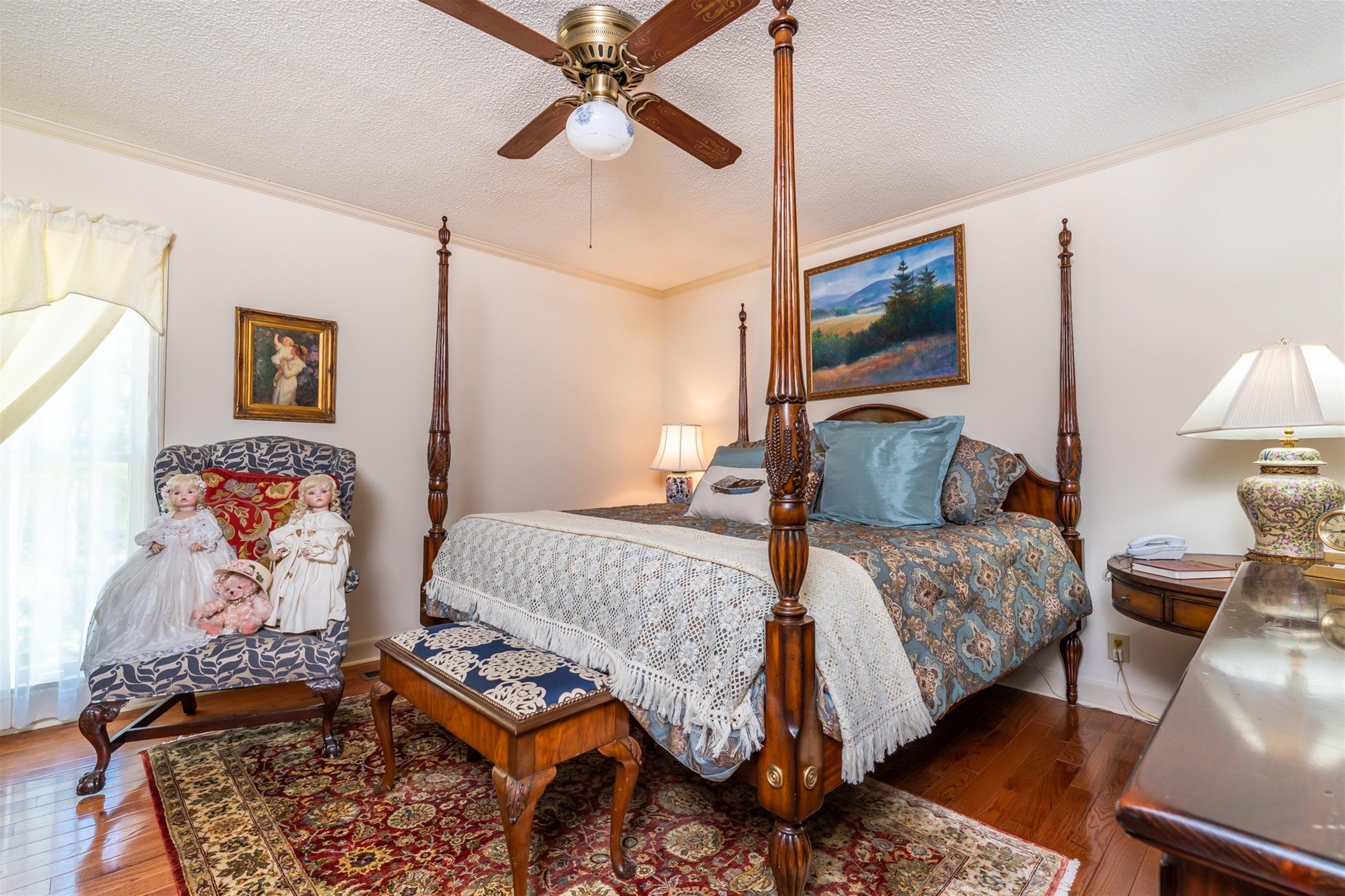 1946 Wood Valley Road Macon, GA 31211 - Photo 23 of 35 a bedroom with a bed and wooden floor