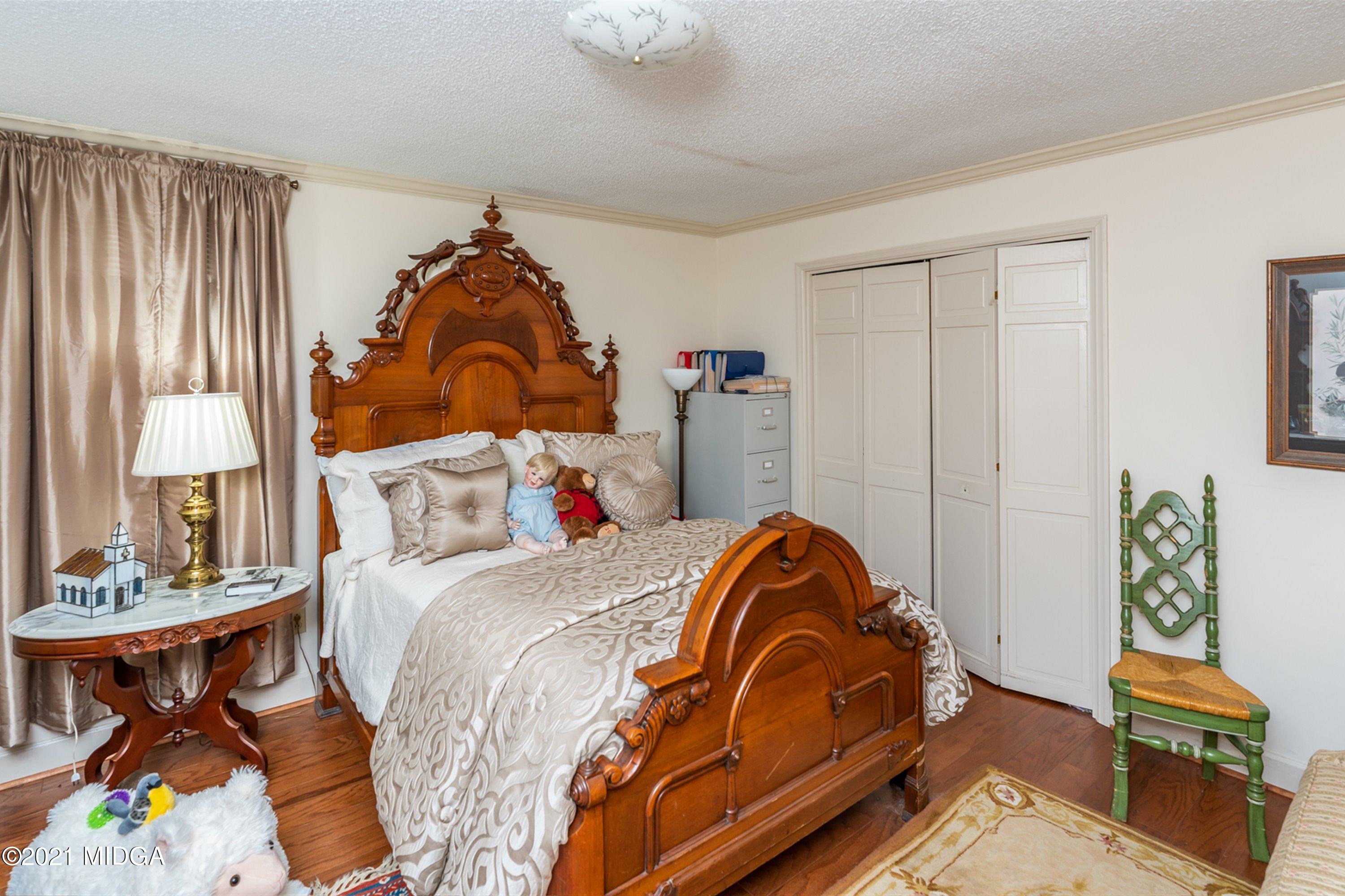 1946 Wood Valley Road Macon, GA 31211 - Photo 26 of 35 a bedroom with a bed and window