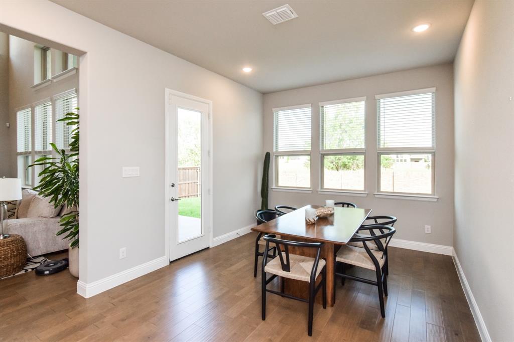 2516 Maidenhair Road Frisco, TX 75033 - Photo 10 of 30 a dining room with furniture and wooden floor
