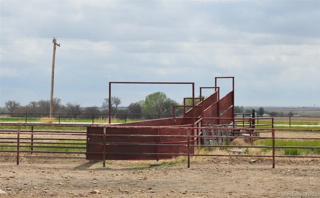 a roof deck with a table and chairs
