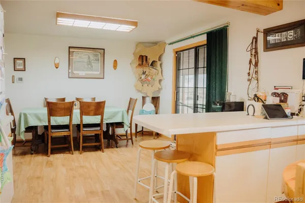 a dining room with furniture and window