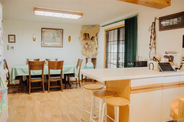 a dining room with furniture and window