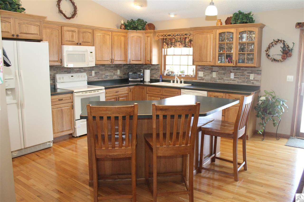 3978 Lavaque Road Hermantown, MN 55811 - Photo 4 of 17 Beautiful hardwood floors and oak cabinets in the kitchen