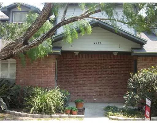 a side view of a house with a yard