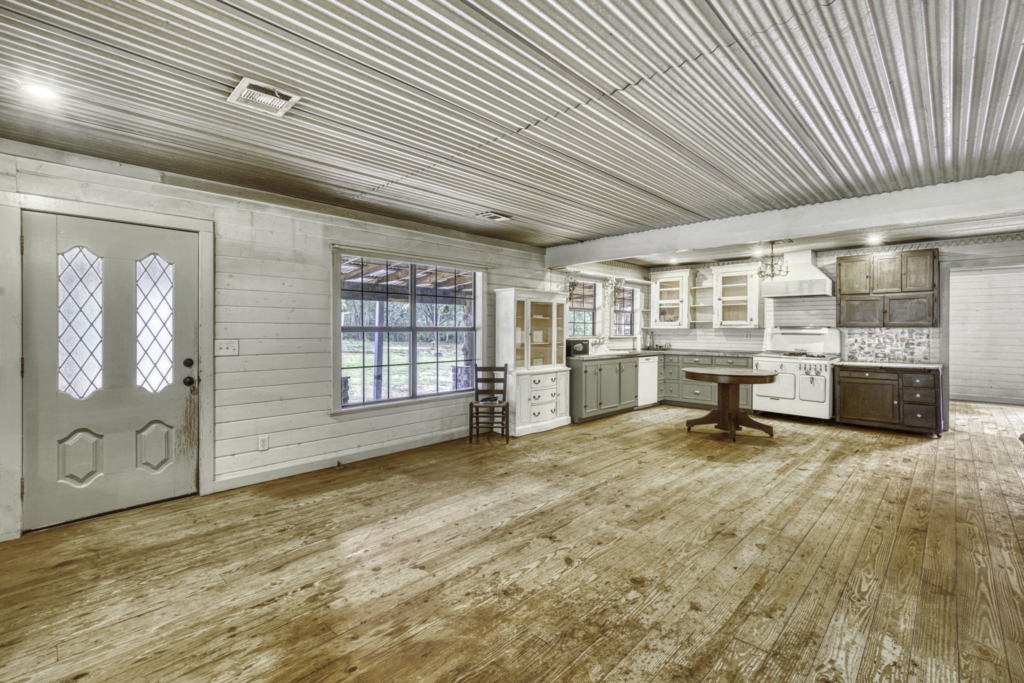 23405 Martha Williams Road Montgomery, TX 77356 - Photo 11 of 45 a view of a livingroom with wooden floor and furniture