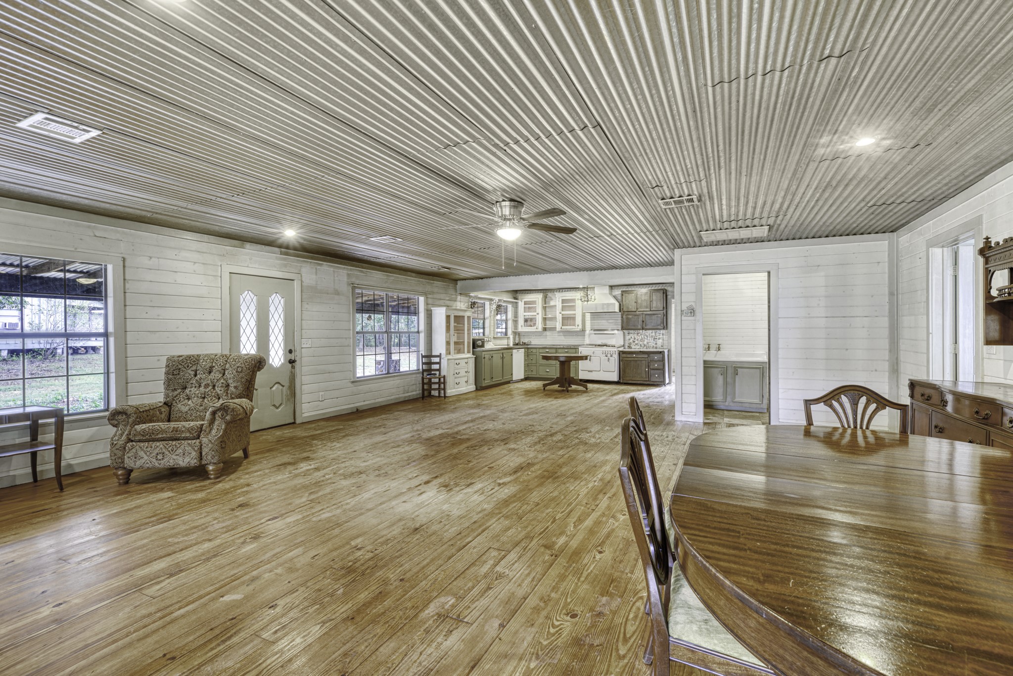 23405 Martha Williams Road Montgomery, TX 77356 - Photo 13 of 45 a view of a dining room with furniture window and wooden floor