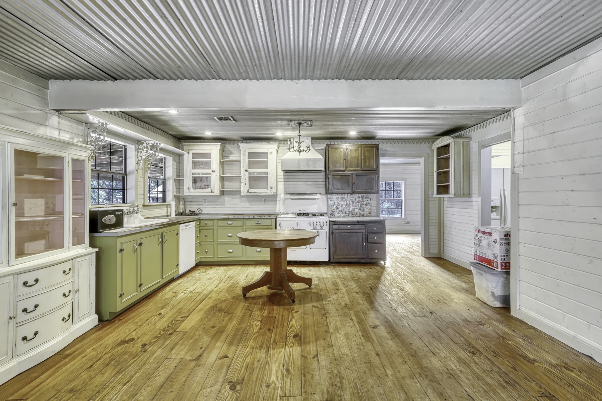 23405 Martha Williams Road Montgomery, TX 77356 - Photo 14 of 45 a kitchen with a sink and wooden cabinets