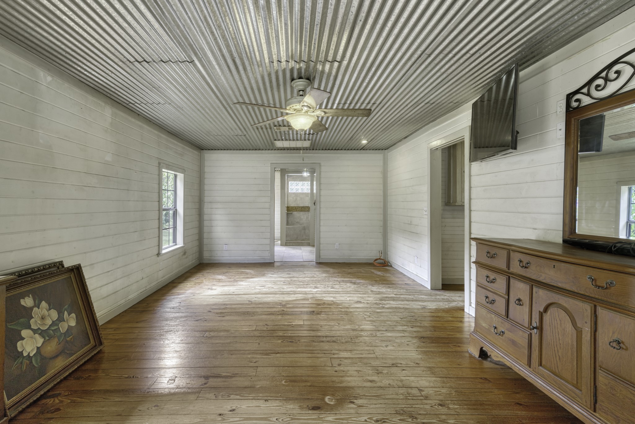 23405 Martha Williams Road Montgomery, TX 77356 - Photo 18 of 45 a view of an empty room with window and wooden floor
