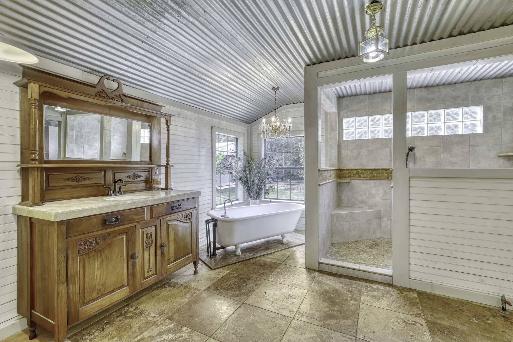 23405 Martha Williams Road Montgomery, TX 77356 - Photo 19 of 45 a spacious bathroom with a granite countertop sink and mirror