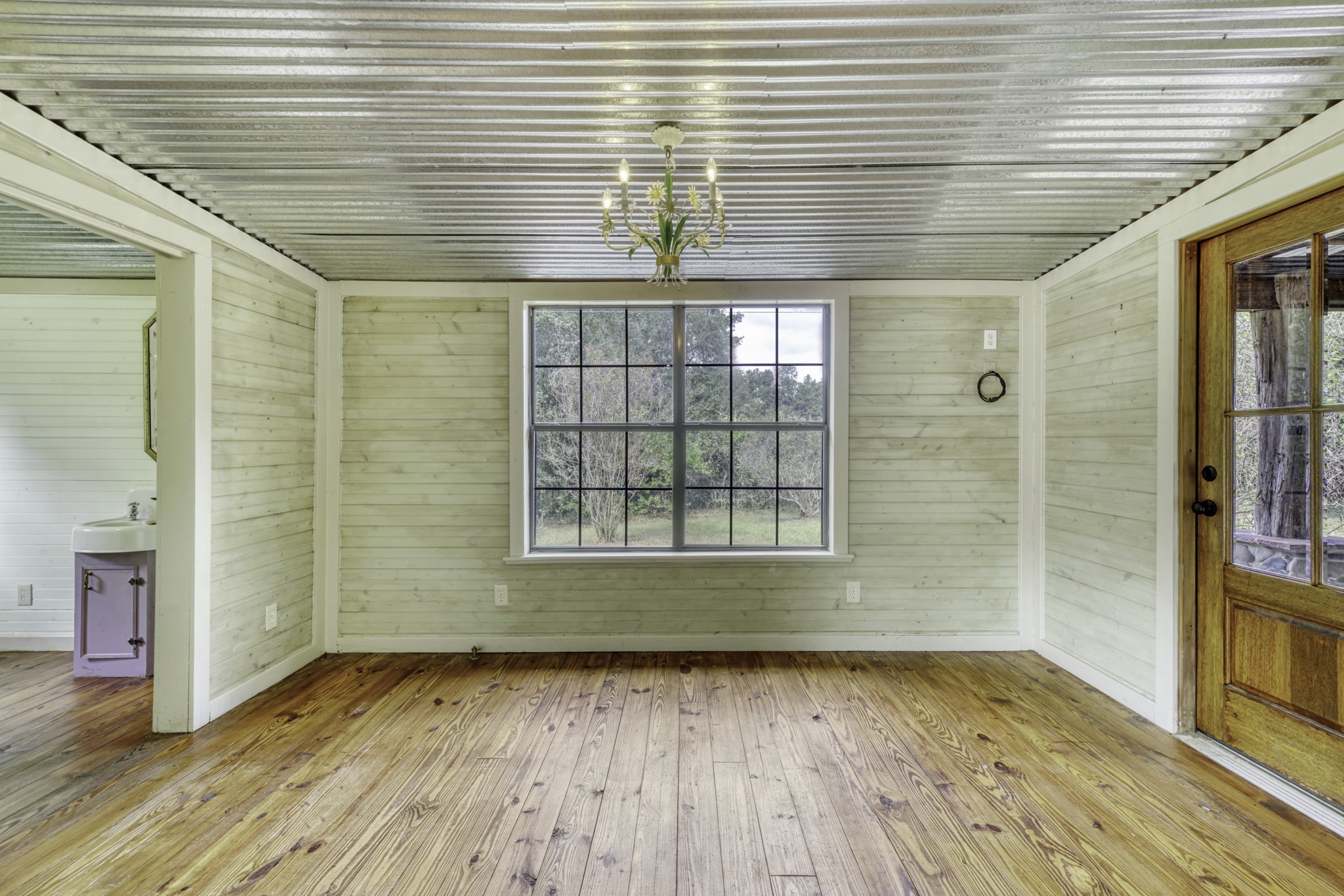 23405 Martha Williams Road Montgomery, TX 77356 - Photo 26 of 45 a view of empty room with wooden floor and fan