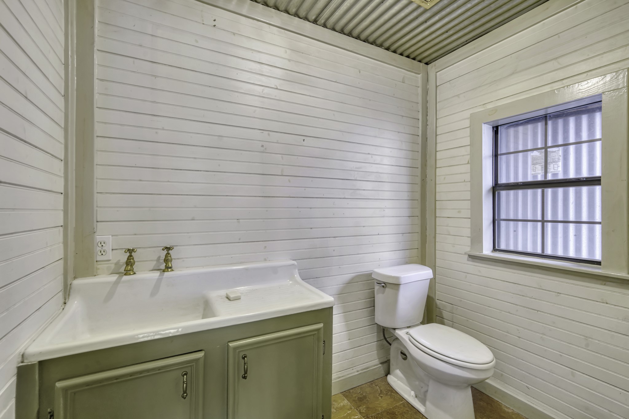 23405 Martha Williams Road Montgomery, TX 77356 - Photo 28 of 45 a bathroom with a sink a toilet and window